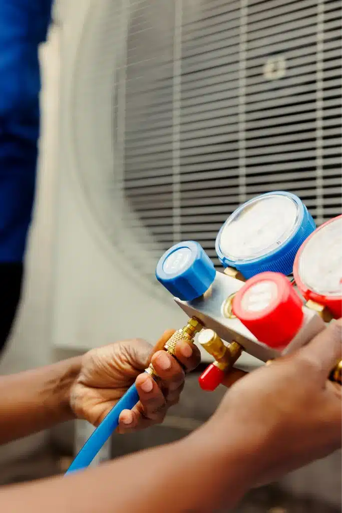 mechanic holding manometer