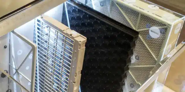 Close-up of HEPA and carbon filters inside a whole home air purifier system.